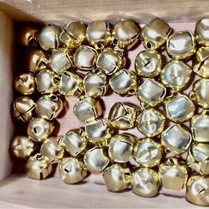 Lot of 45 small 1/2” gold tone bells with slot - sew on, string or decorate with
